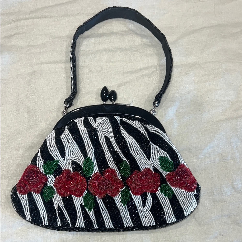 Elegant Black and White Beaded Clutch with Red Floral Design